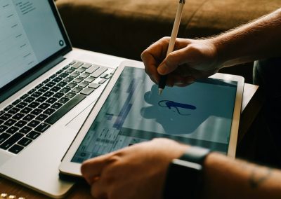 person writing on white paper